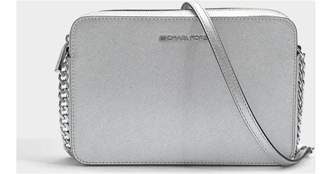 michael kors silver crossbody bag.